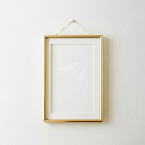 Golden photo frame mockup hanging on a plain white background