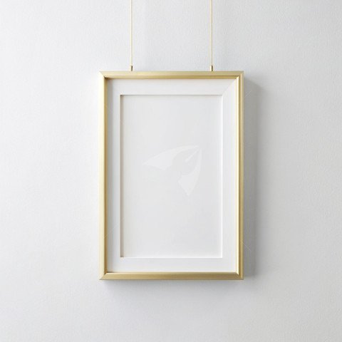 Golden photo frame mockup hanging on a plain white background